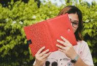 Woman with notebook in hand