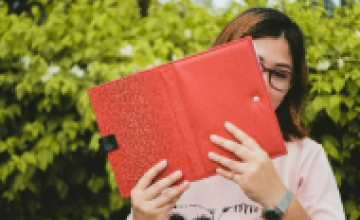 Woman with notebook in hand